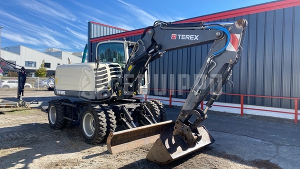 Bild des Terex Tw 85 mit 3 Löffeln und Gabeln